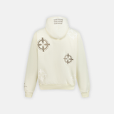 Bullseye Hoodie in cream with a repeating bullseye graphic pattern and Interludex text on the hood