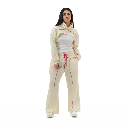 Bullseye Cropped Set in cream with pink piping, worn by a woman